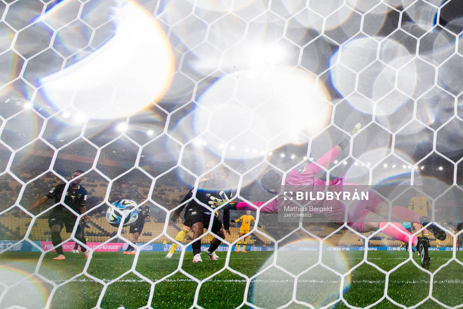 Fridolina Rolfö of Sweden scores 1-1 behind goalkeeper