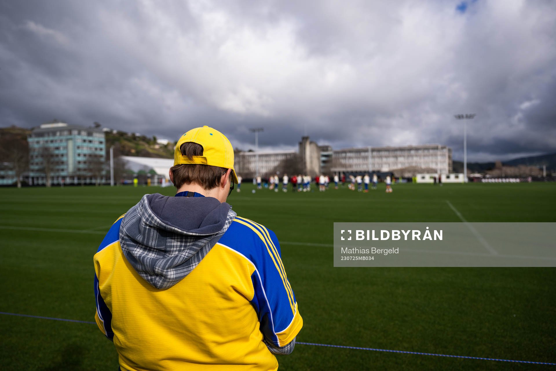 A fan watches players of the Swedish women’s national