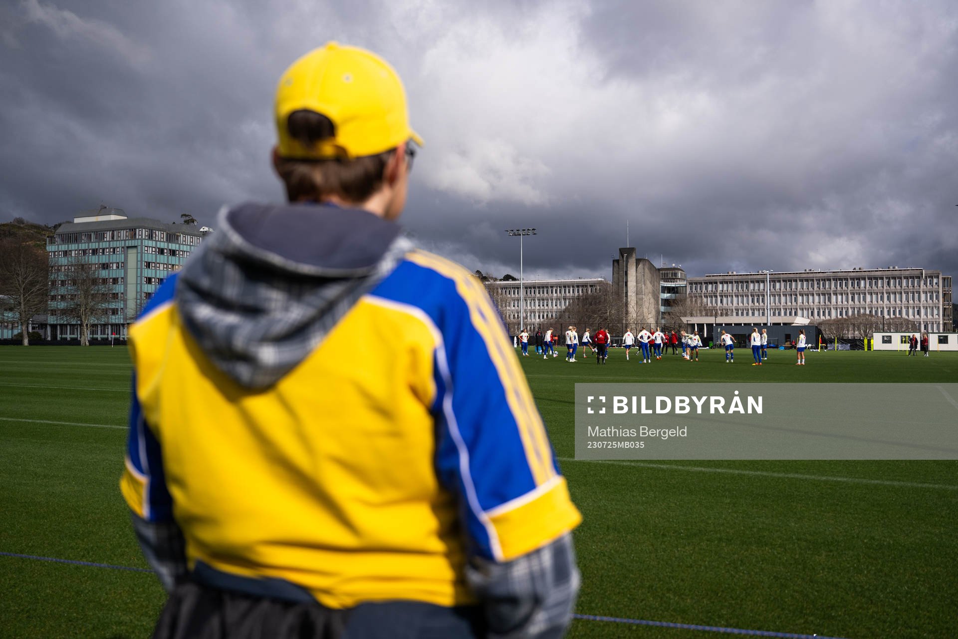 A fan watches players of the Swedish women’s national
