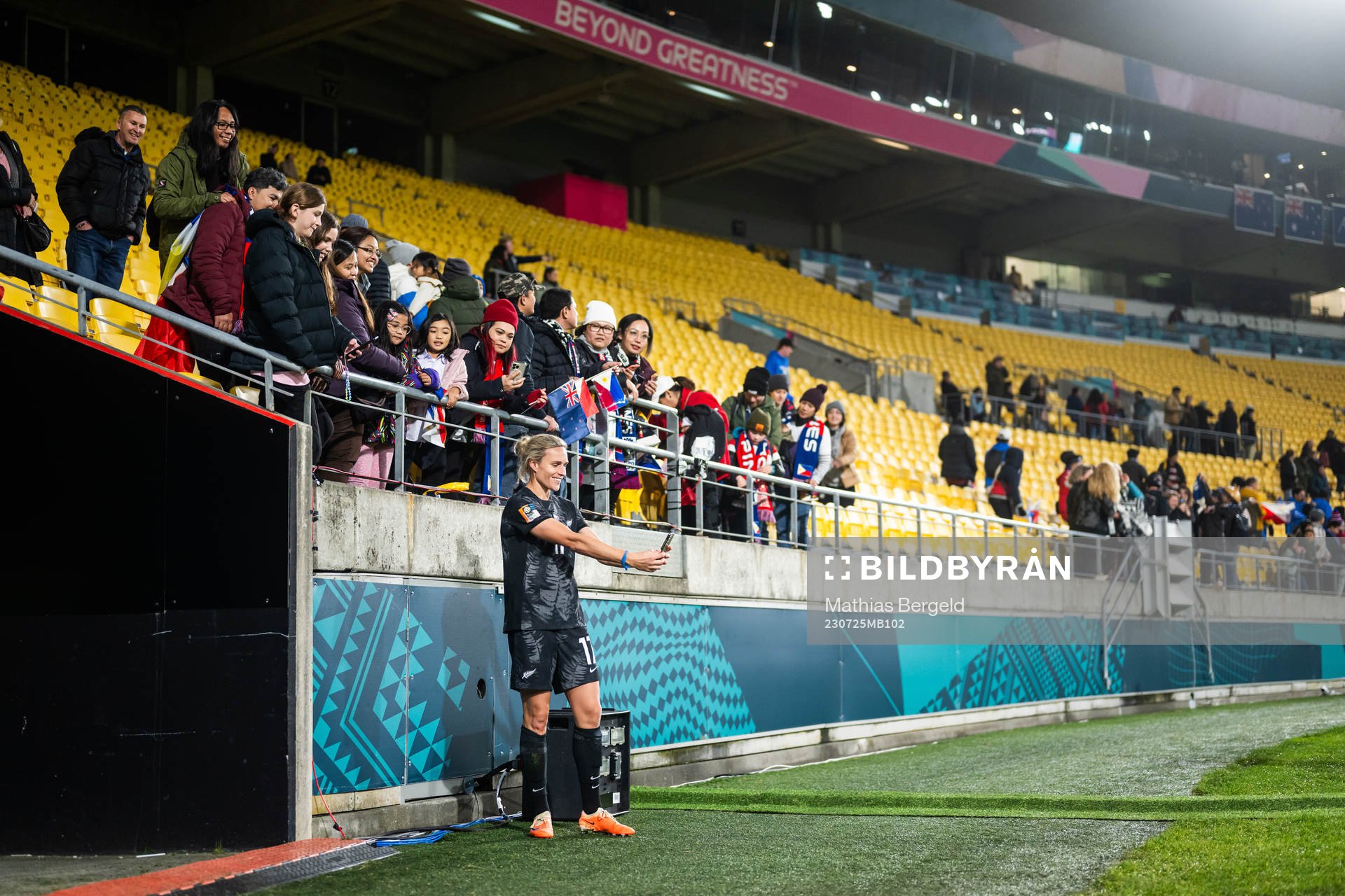 Hannah Wilkinson of New Zealand takes pictures with