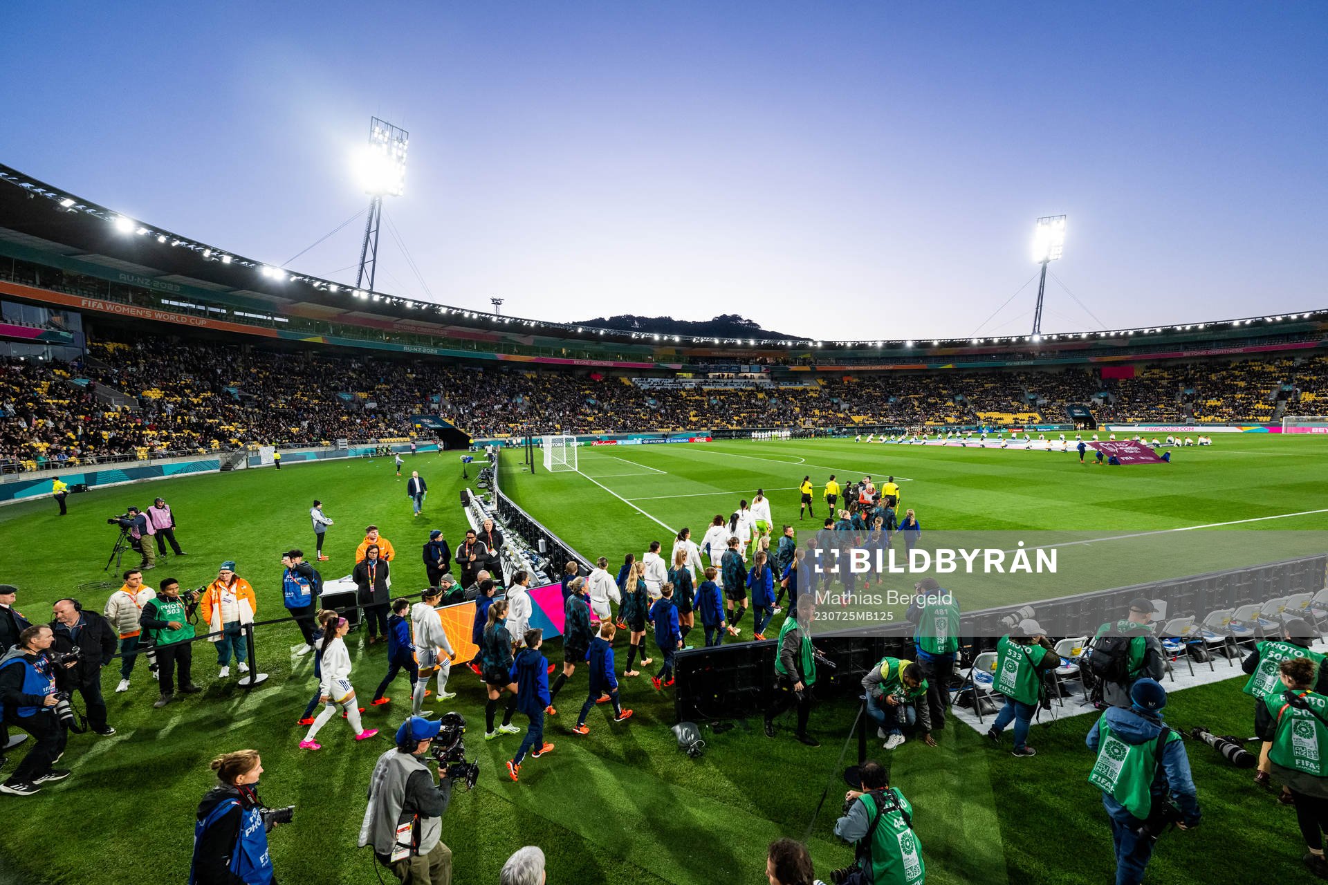 Players of Philippines and of New Zealand enter the pitch