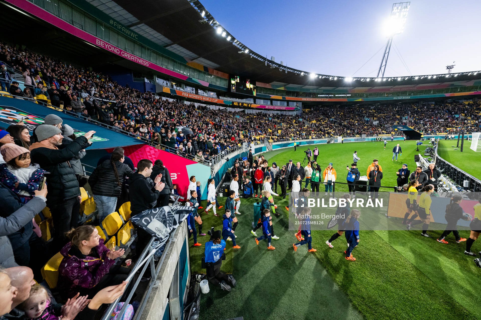 Players of Philippines and of New Zealand enter the pitch