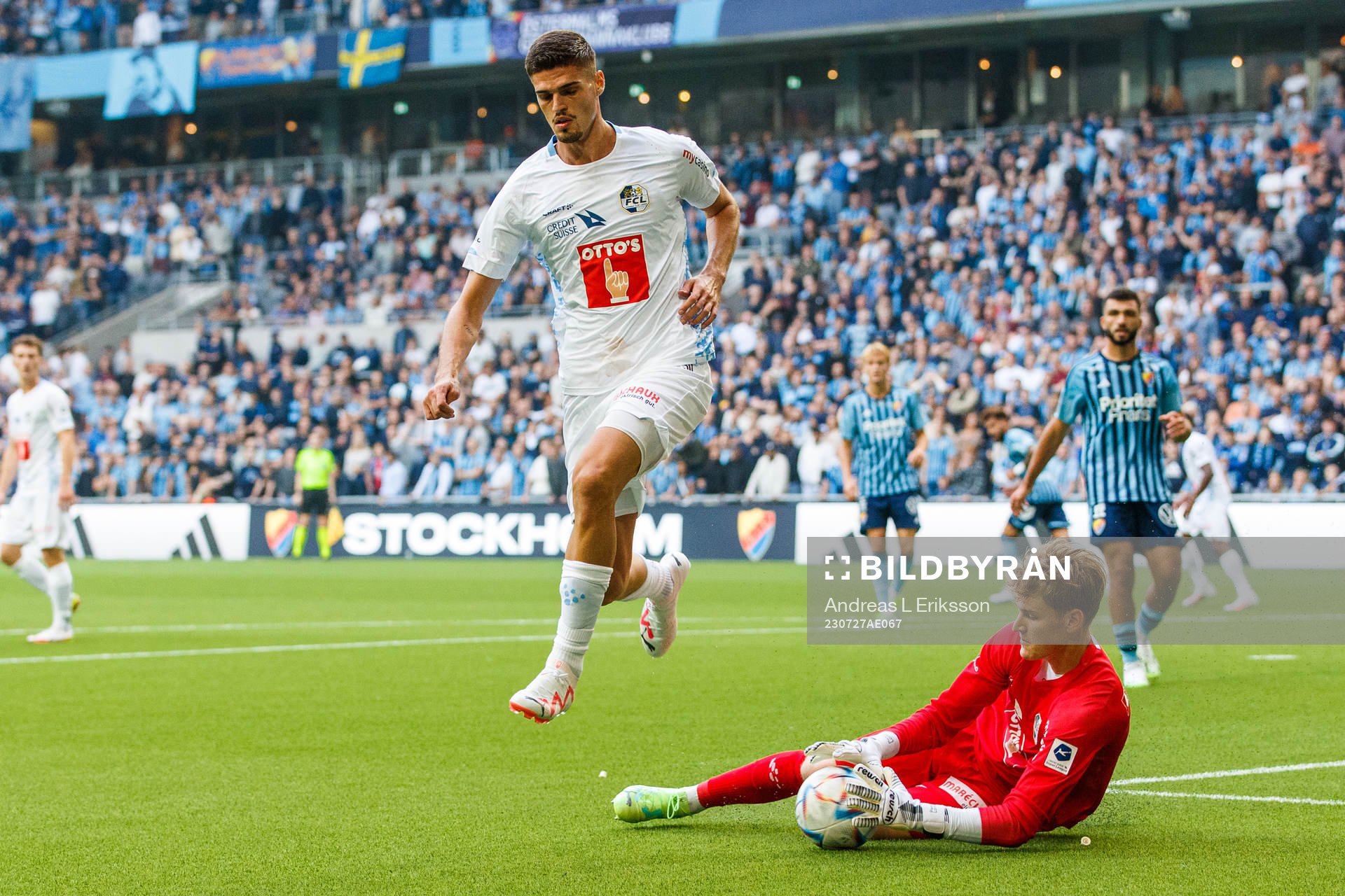 Ismajl Beka and goalkeeper Pascal Loretz of Luzern