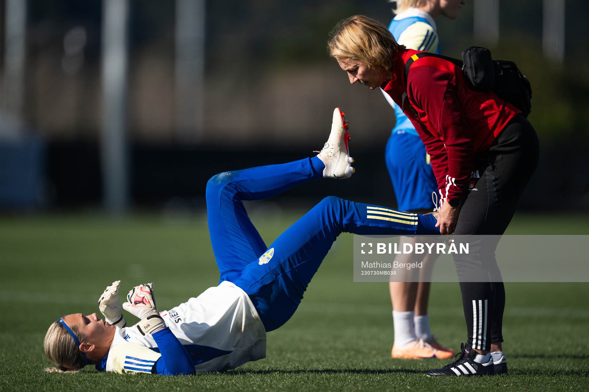 Goalkeeper Jennifer Falk receives treatment from physio