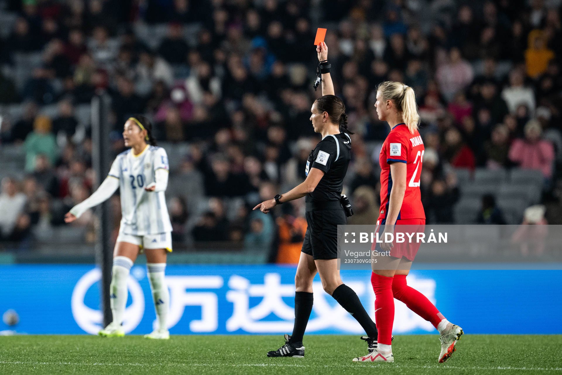 Referee Marie-Soleil Beaudoin shows a red card to Sofia
