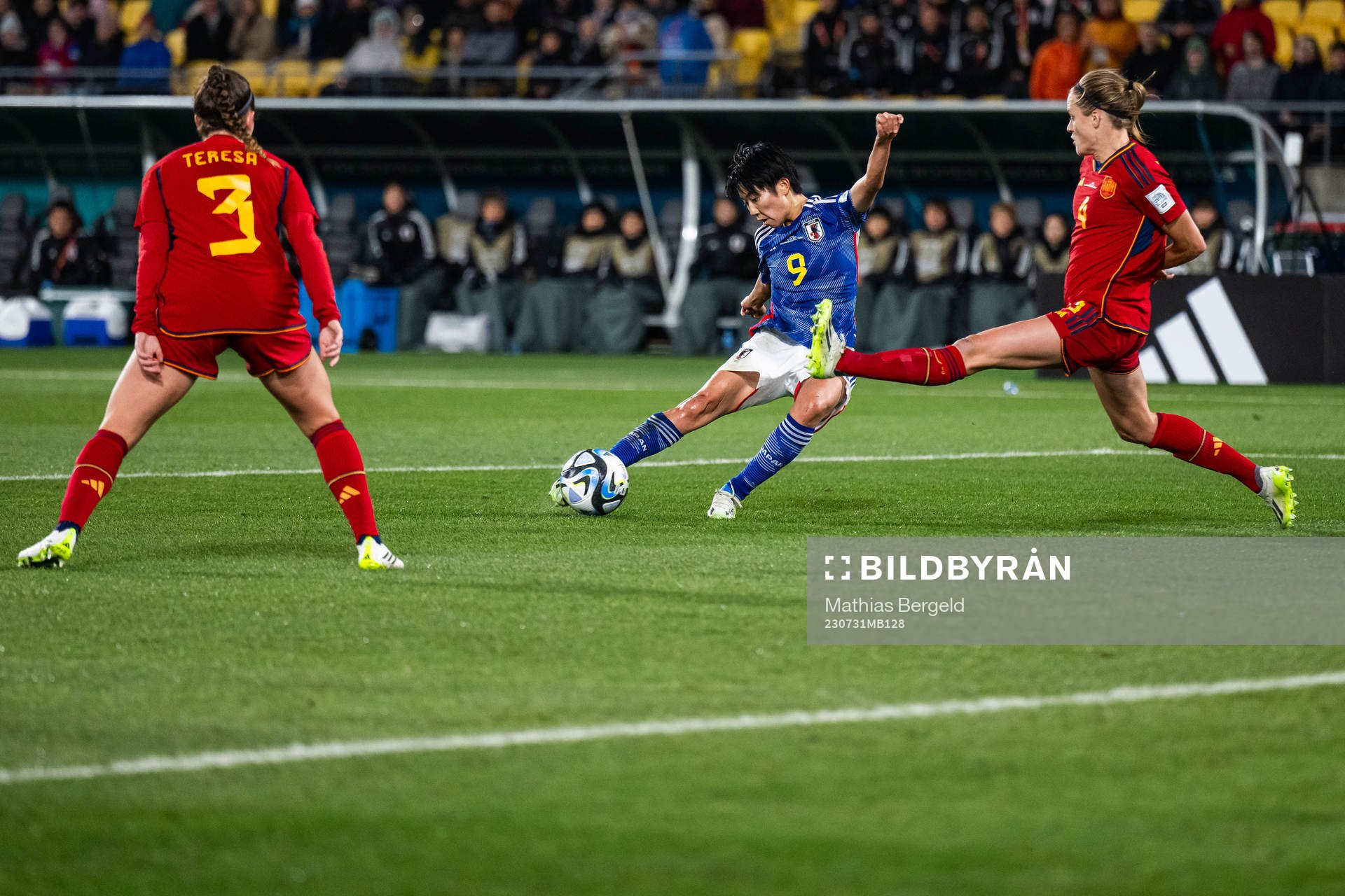 Riko Ueki of Japan scores 2-0 competing with Irene Paredes
