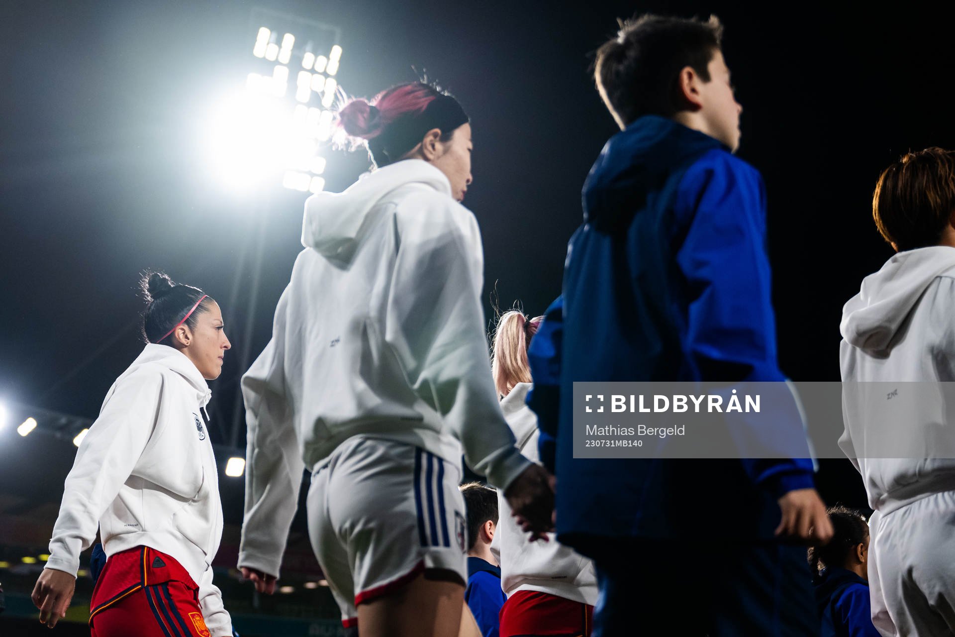 Jennifer Hermoso of Spain and Jun Endo of Japan enter the