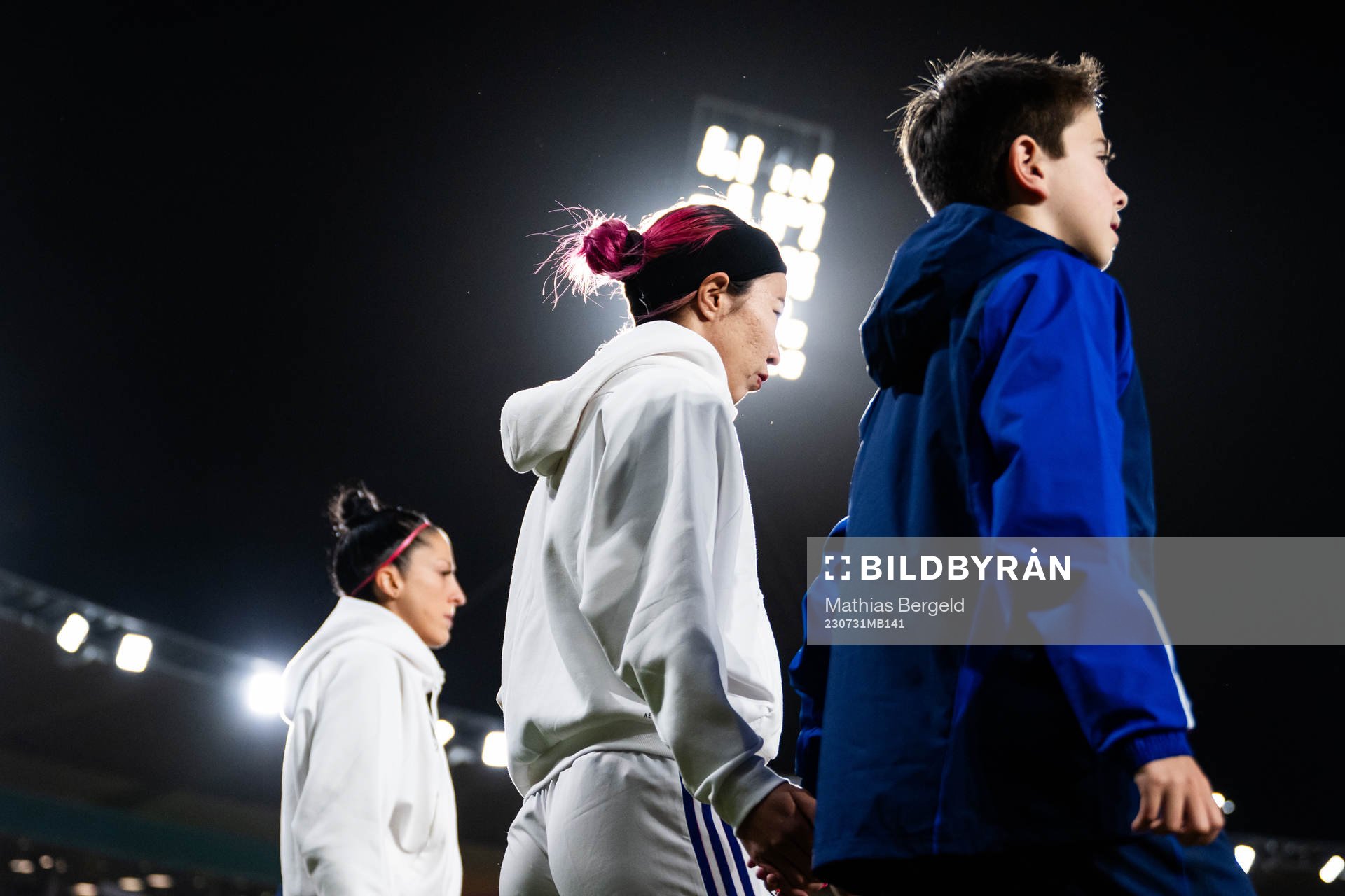 Jennifer Hermoso of Spain and Jun Endo of Japan enter the