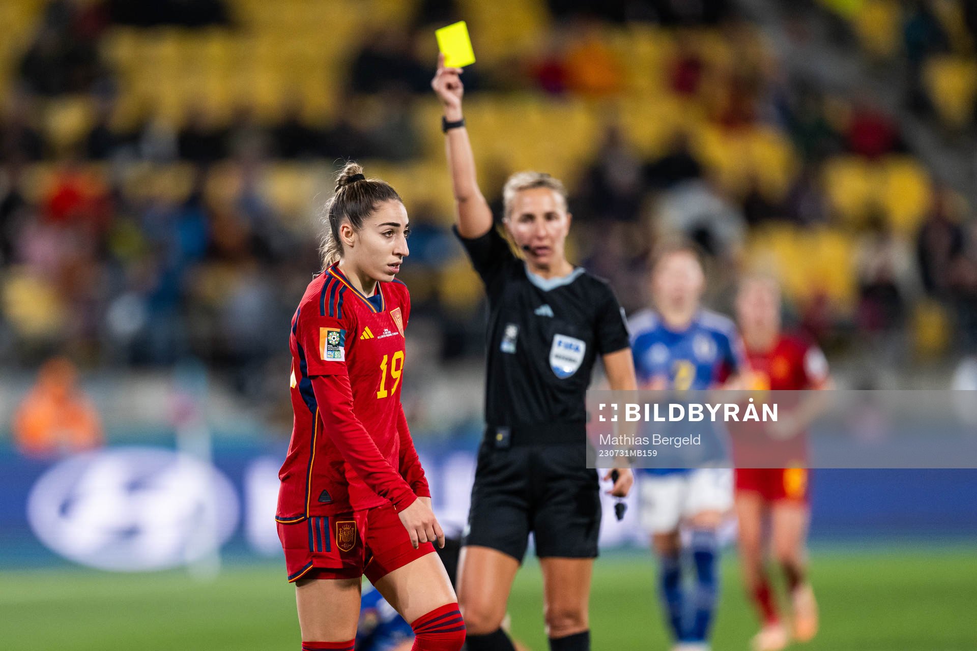 Referee Ekaterina Koroleva gives a yellow card to Olga