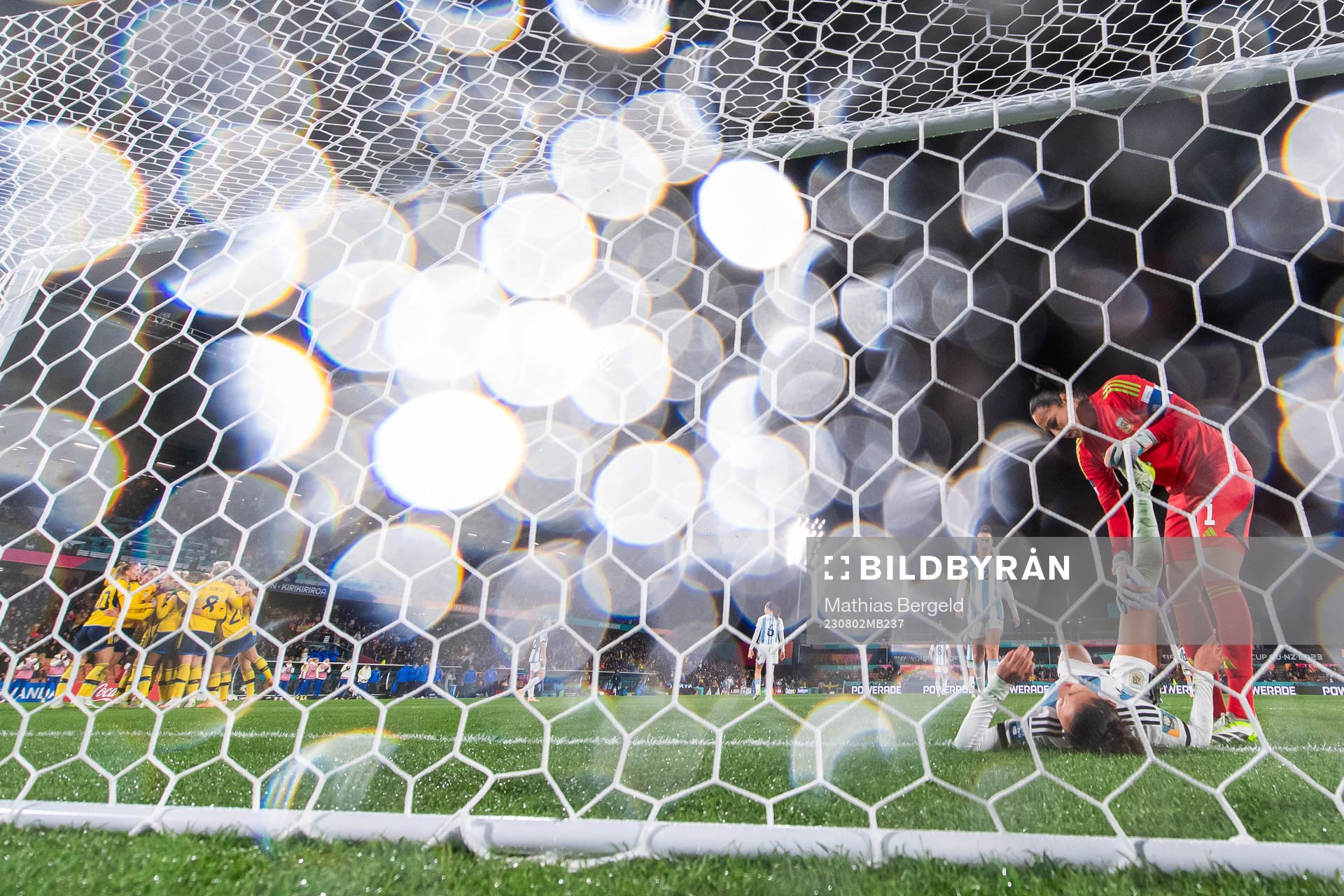 Rebecka Blomqvist of Sweden celebrates with team mates after scoring 0-1 while Julieta Cruz receives help from goalkeeper Vanina Correa during the FIFA Women's World Cup football match between Argentina and Sweden on August 2, 2023 in Hamilton.