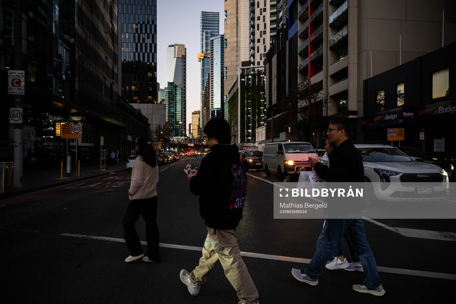 People cross a street