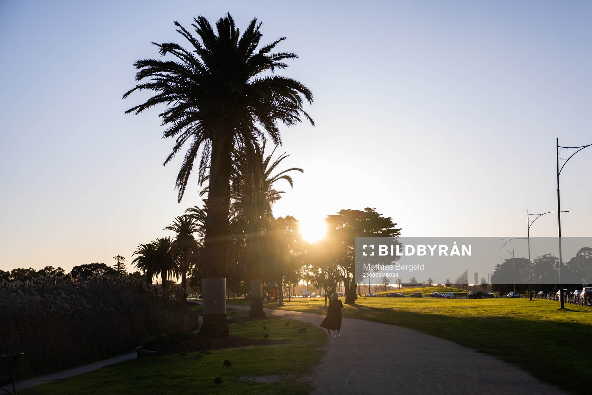 A woman walks in Albert Park