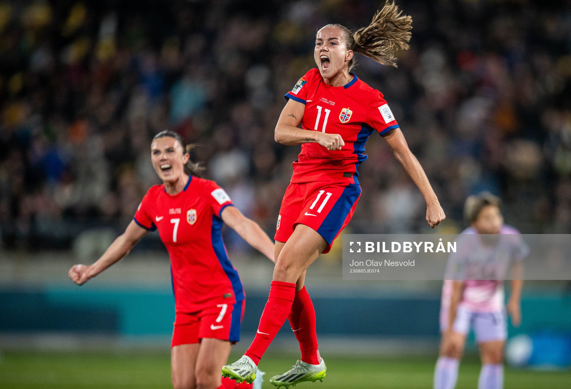 Ingrid Syrstad Engen and Guro Reiten of Norway celebrates