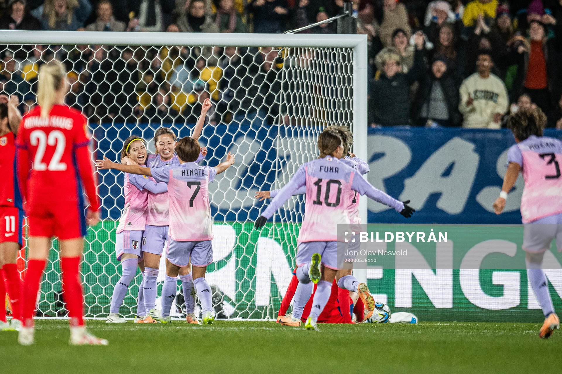 Players of Japan celebrate 2-1