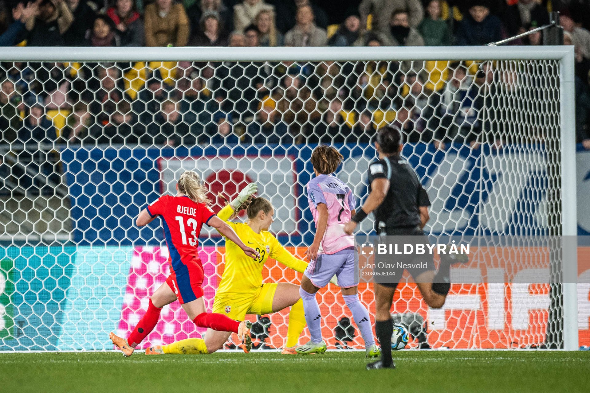 Hinata Miyazawa of Japan scores 3-1 behind goalkeeper
