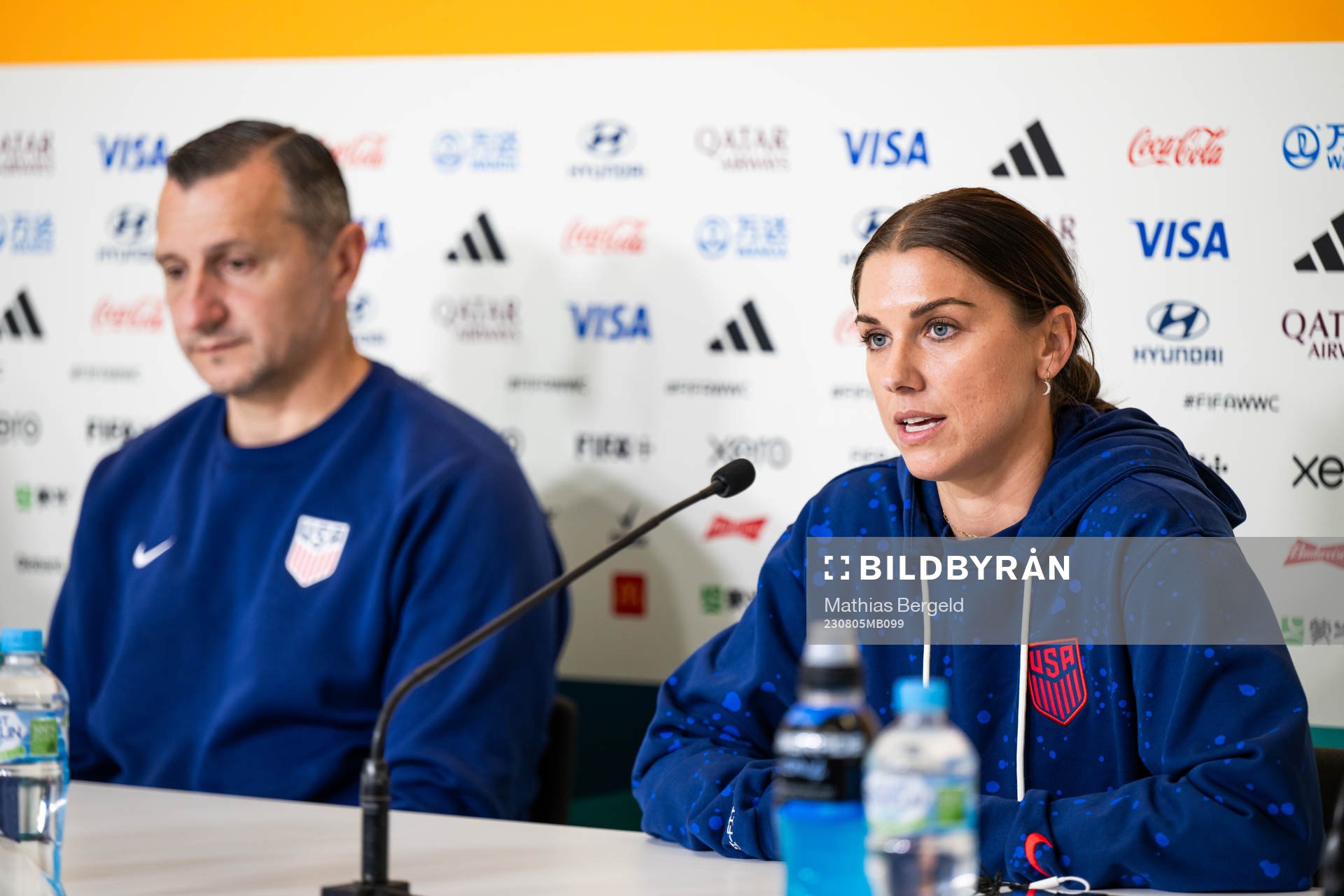 Head coach Vlatko Andonovski and Alex Morgan at a press
