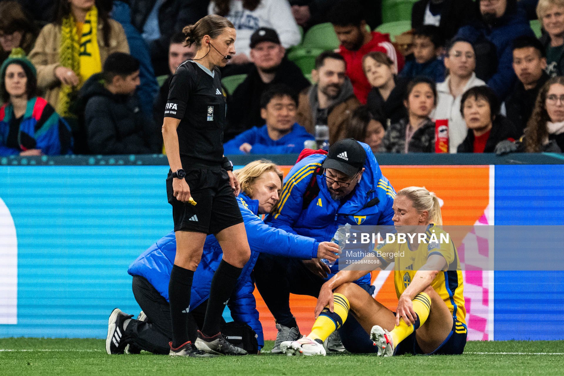 Jonna Andersson of Sweden receives medical treatment from