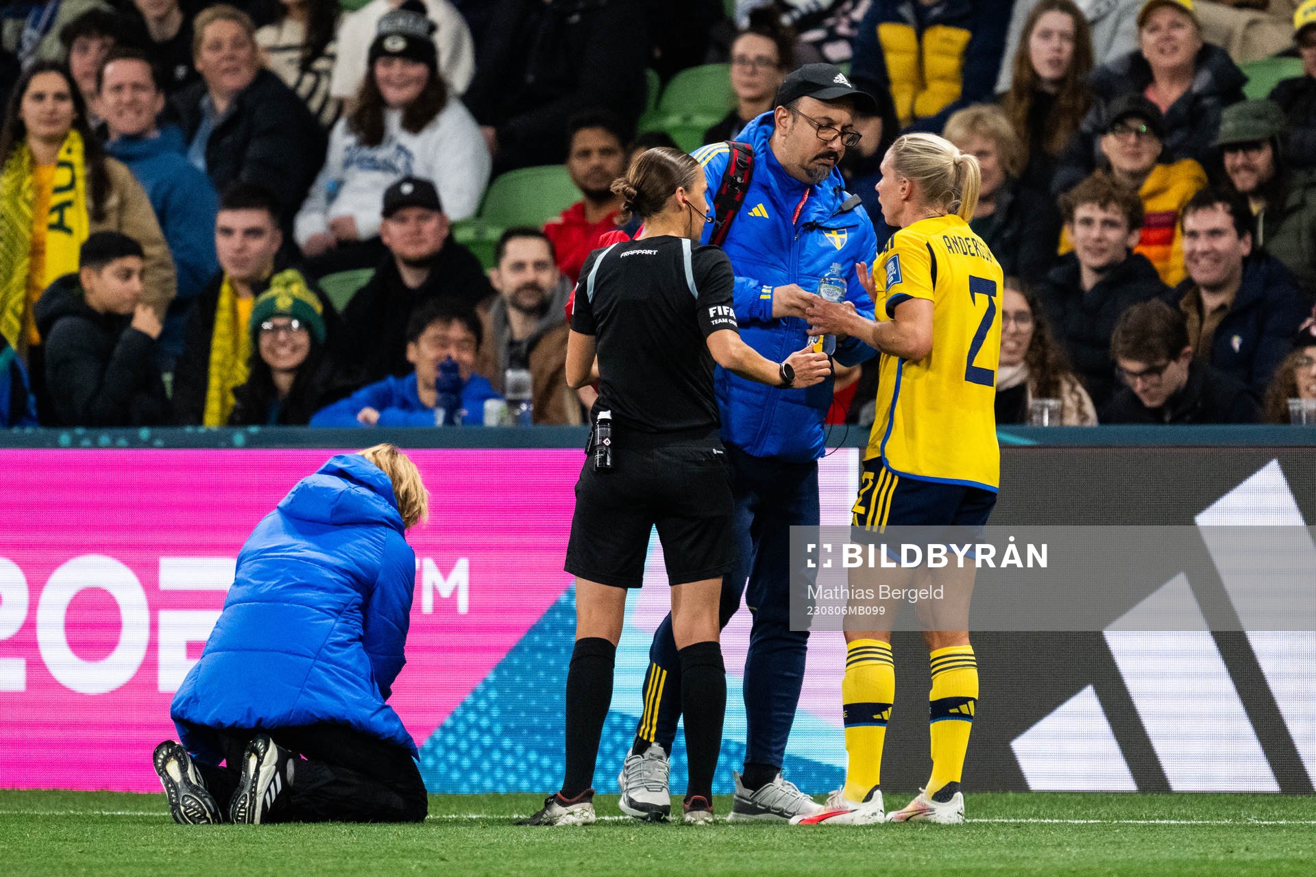 Jonna Andersson of Sweden receives medical treatment from