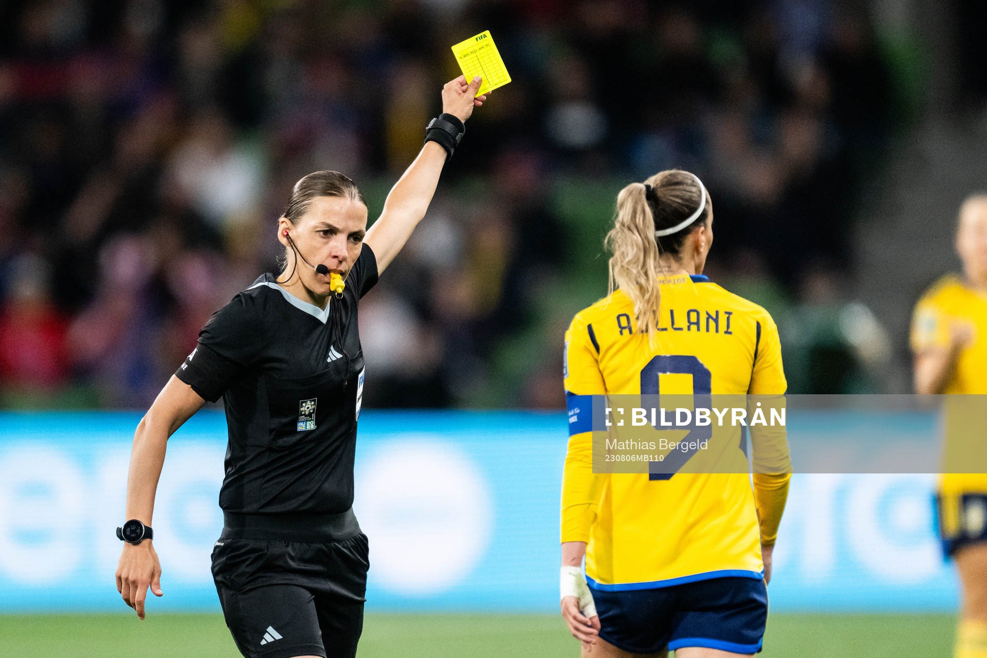 Kosovare Asllani of Sweden is shown a yellow card by