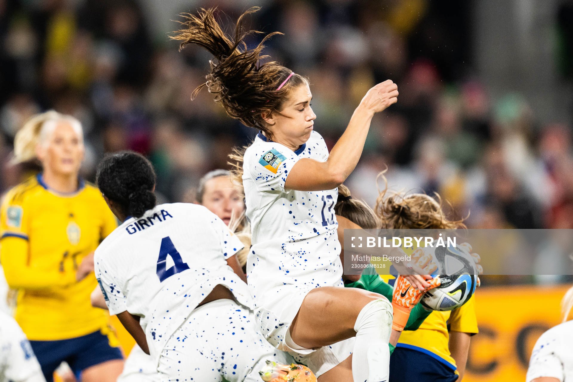 Alex Morgan and goalkeeper Alyssa Naeher of USA