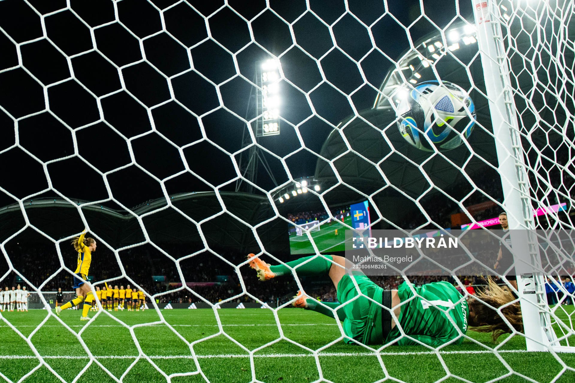 Elin Rubensson of Sweden scores a goal behind goalkeeper