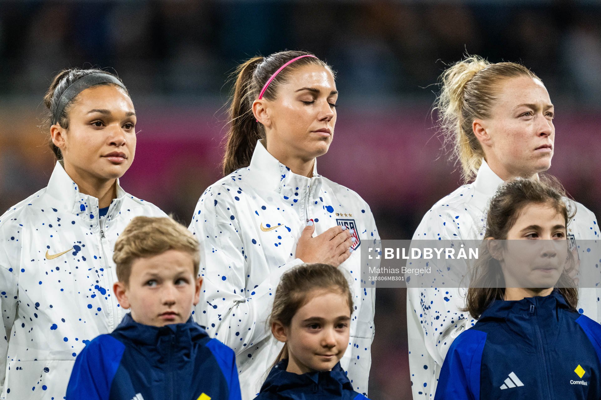 Sophia Smith, Alex Morgan and Emily Sonnett of USA