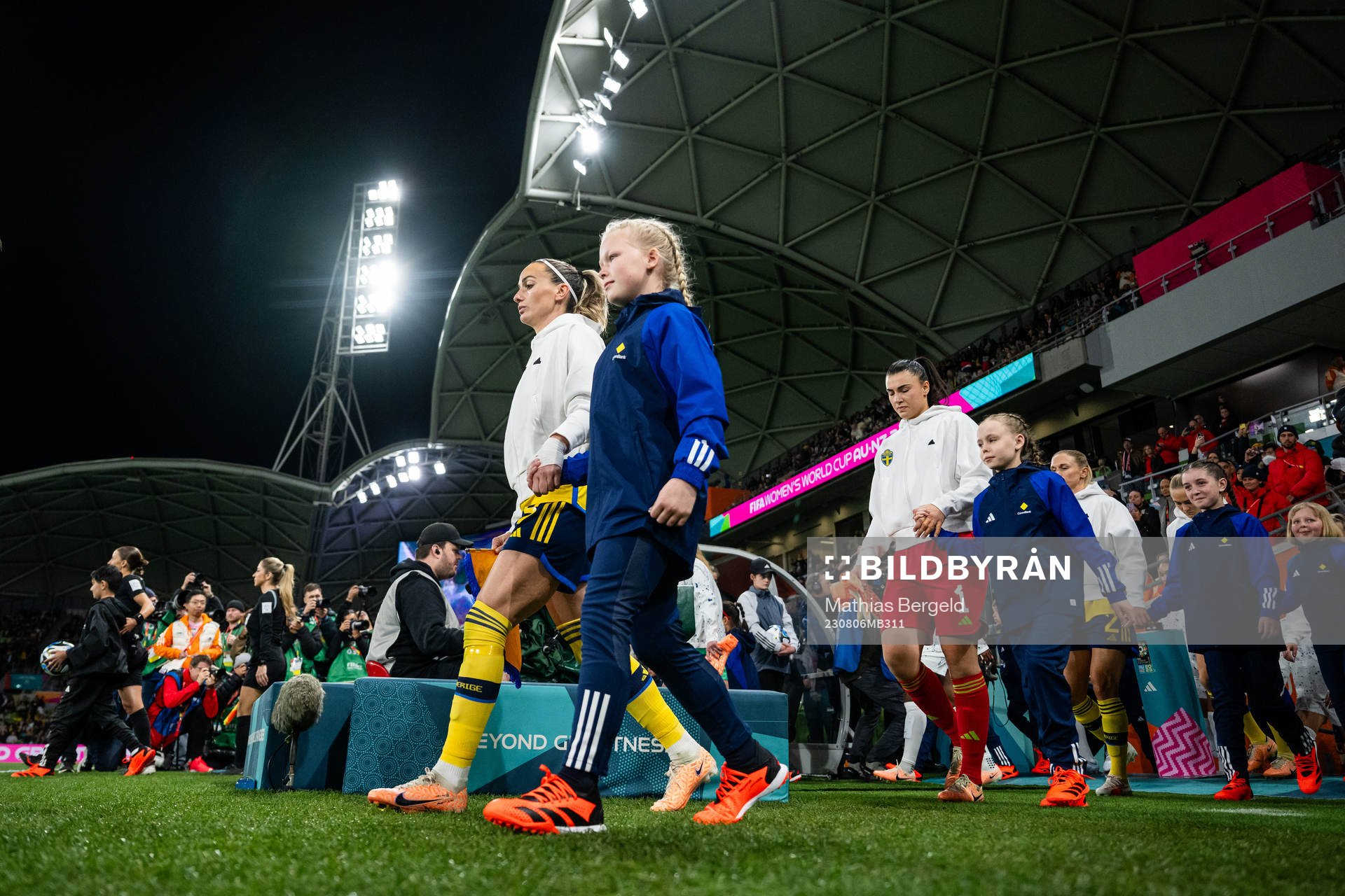 Kosovare Asllani and goalkeeper Zecira Musovic of Sweden