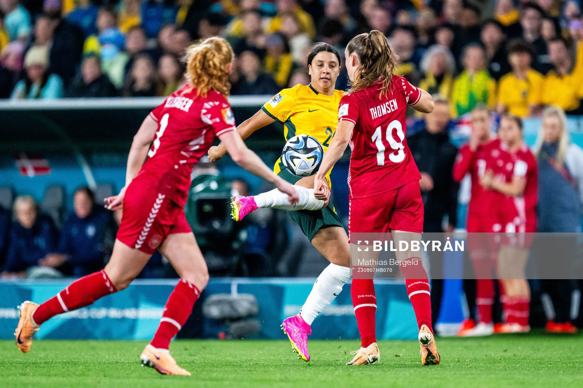 Sam Kerr of Australia and Janni Thomsen of Denmark
