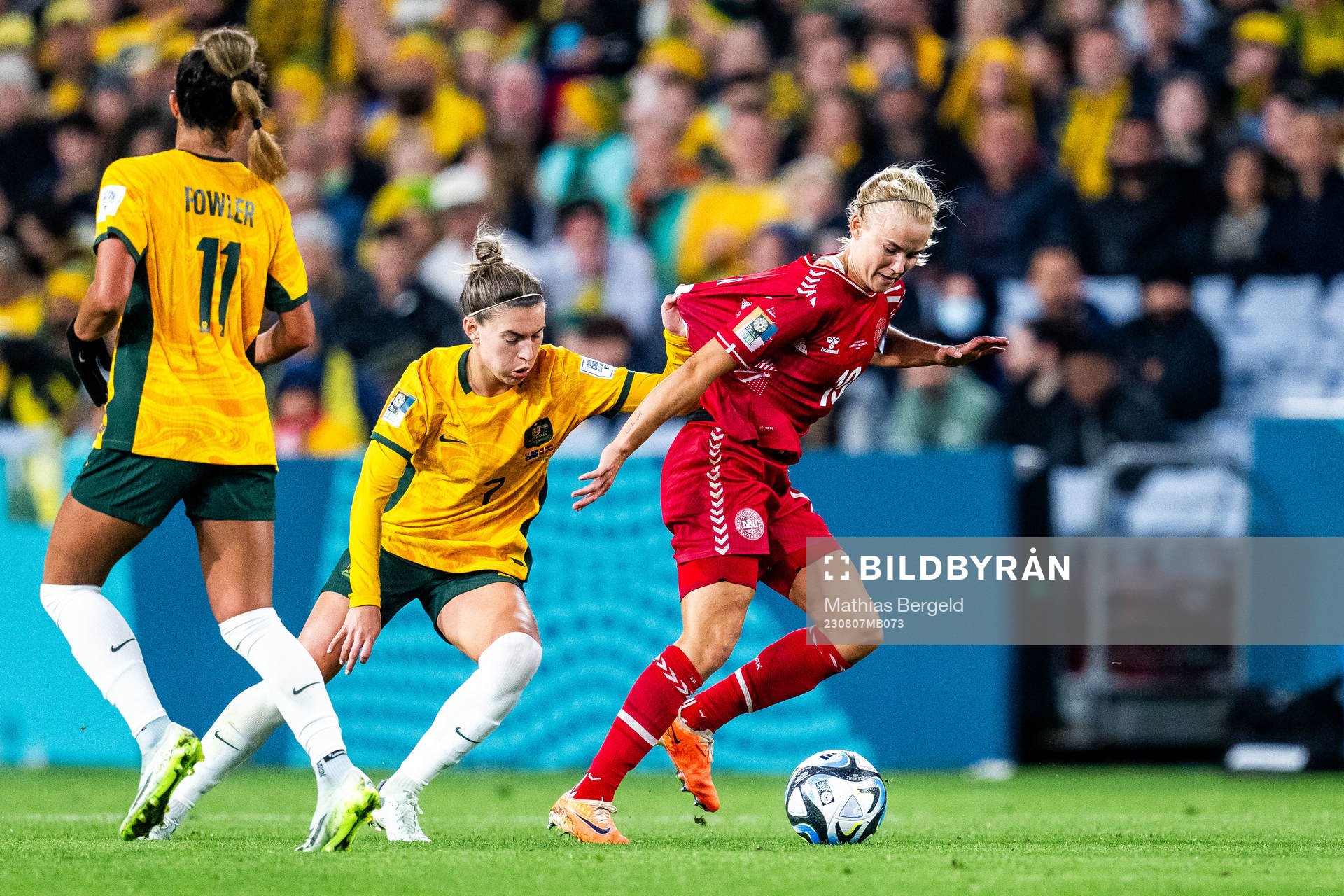 Steph Catley of Australia and Pernille Harder of Denmark