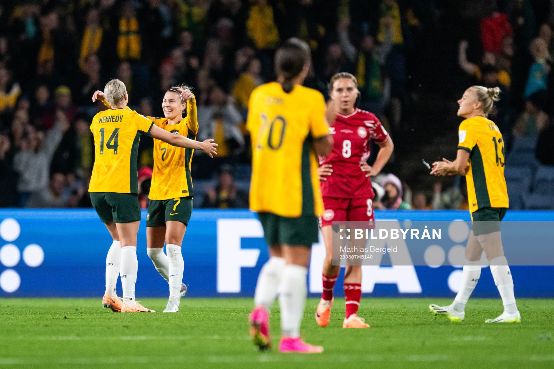 Alanna Kennedy and Steph Catley of Australia celebrate after the FIFA Women's World Cup round of 16 football match match between Australia and Denmark on August 7, 2023 in Sydney.