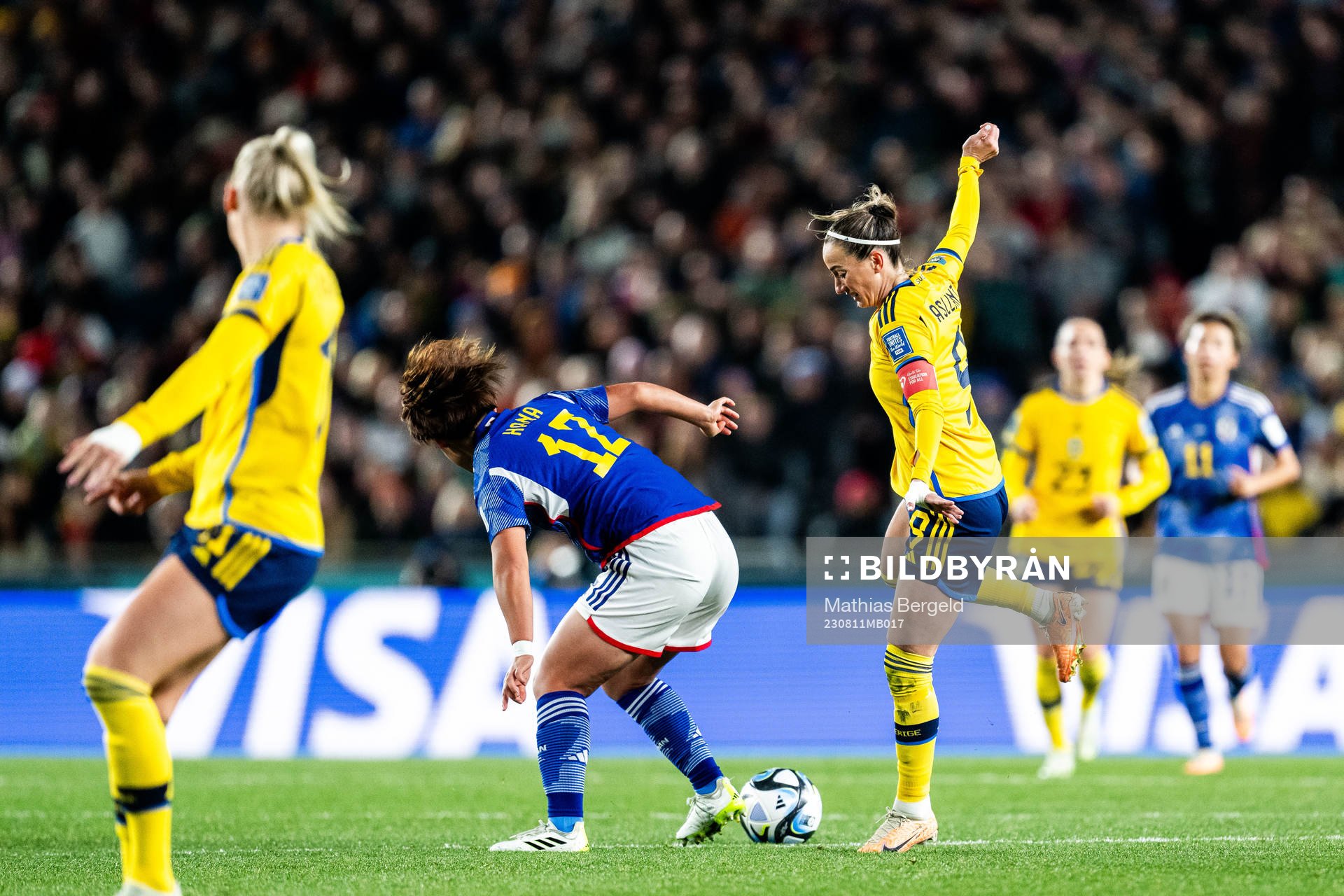 Hana Takahashi of Japan and Kosovare Asllani of Sweden