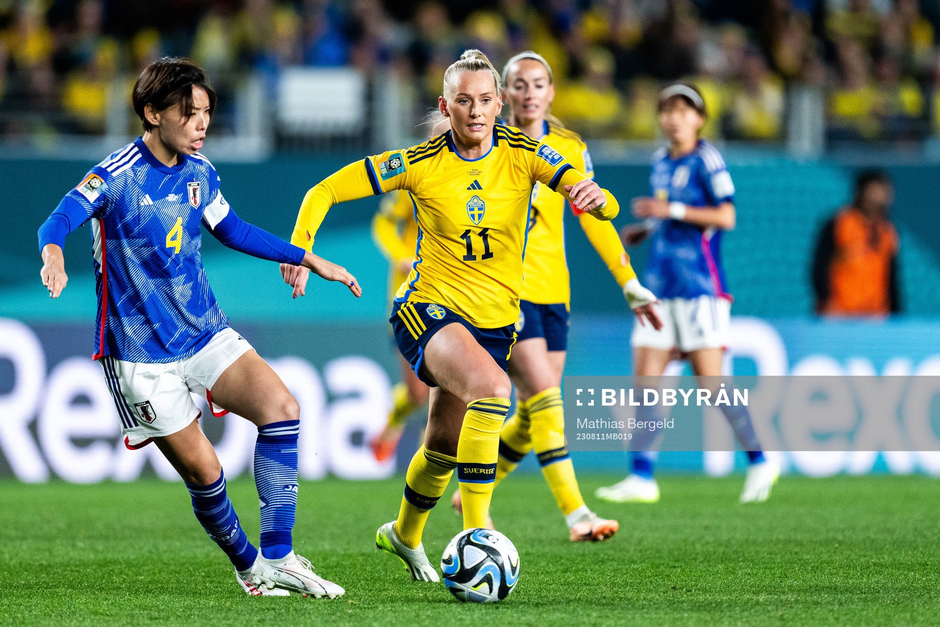 Saki Kumagai of Japan and Stina Blackstenius of Sweden