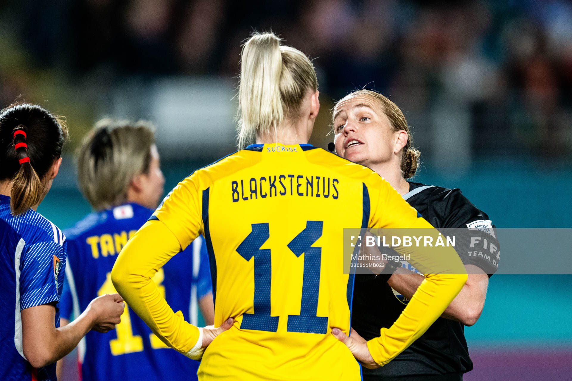 Stina Blackstenius of Sweden in discussion with referee