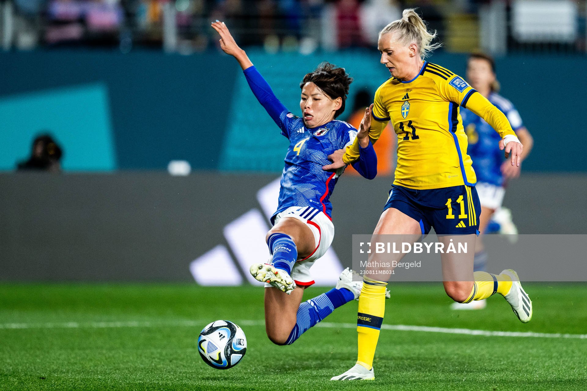 Saki Kumagai of Japan and Stina Blackstenius of Sweden