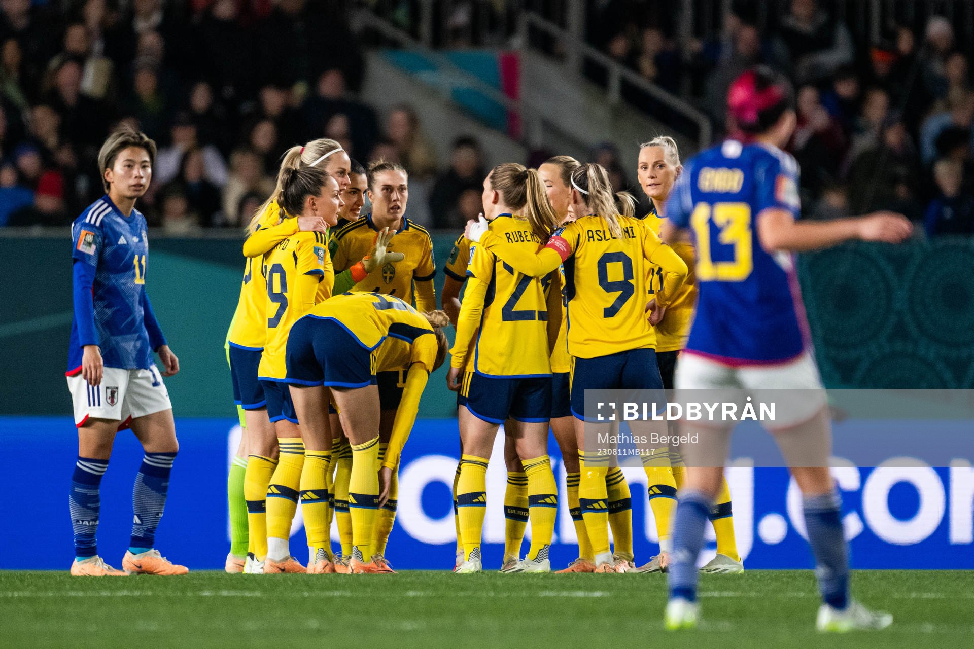 Players of Sweden gather at a VAR check