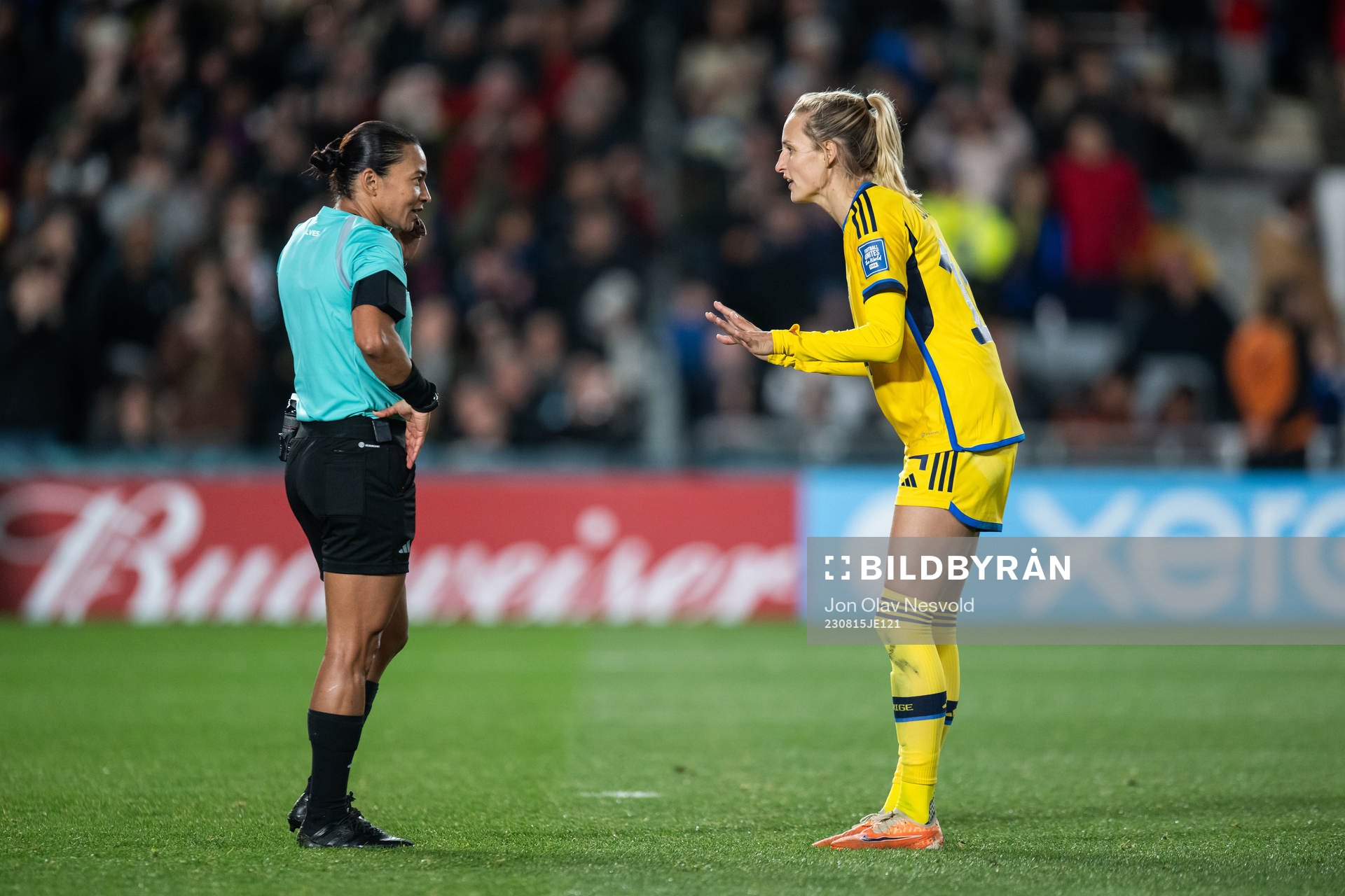 referee Edina Alves and Nathalie Björn of Sweden