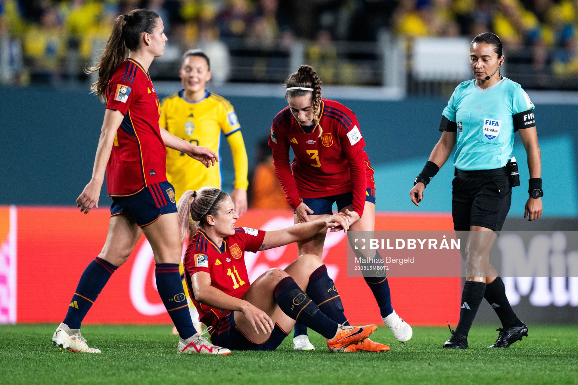 Alexia Putellas and Teresa Abelleira of Spain with  referee