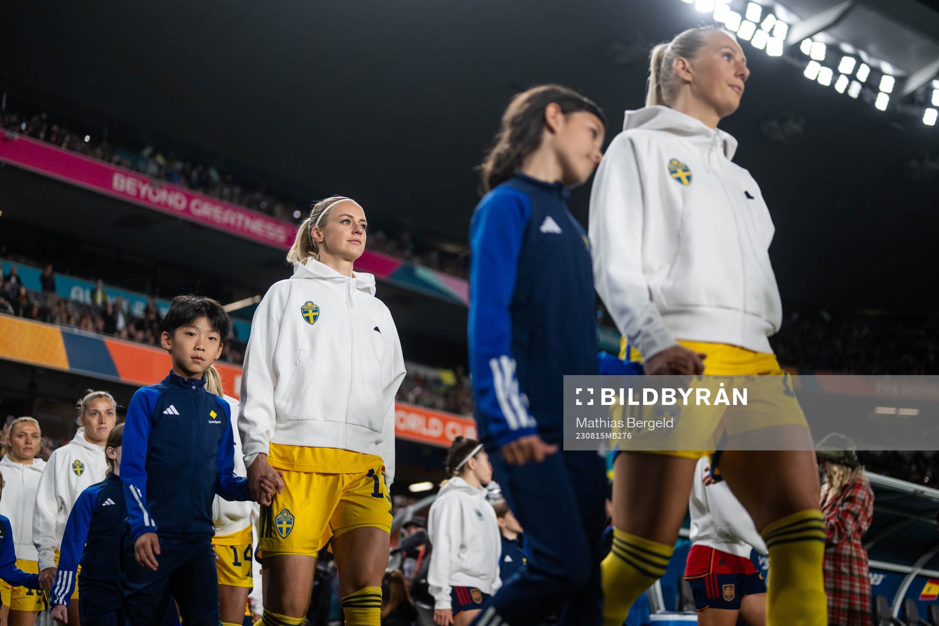 Amanda Ilestedt and Stina Blackstenius of Sweden enter the