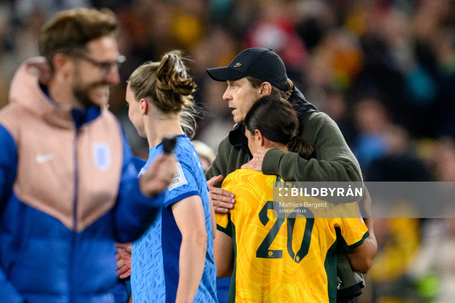 Head coach Tony Gustavsson of Australia hugs Sam Kerr