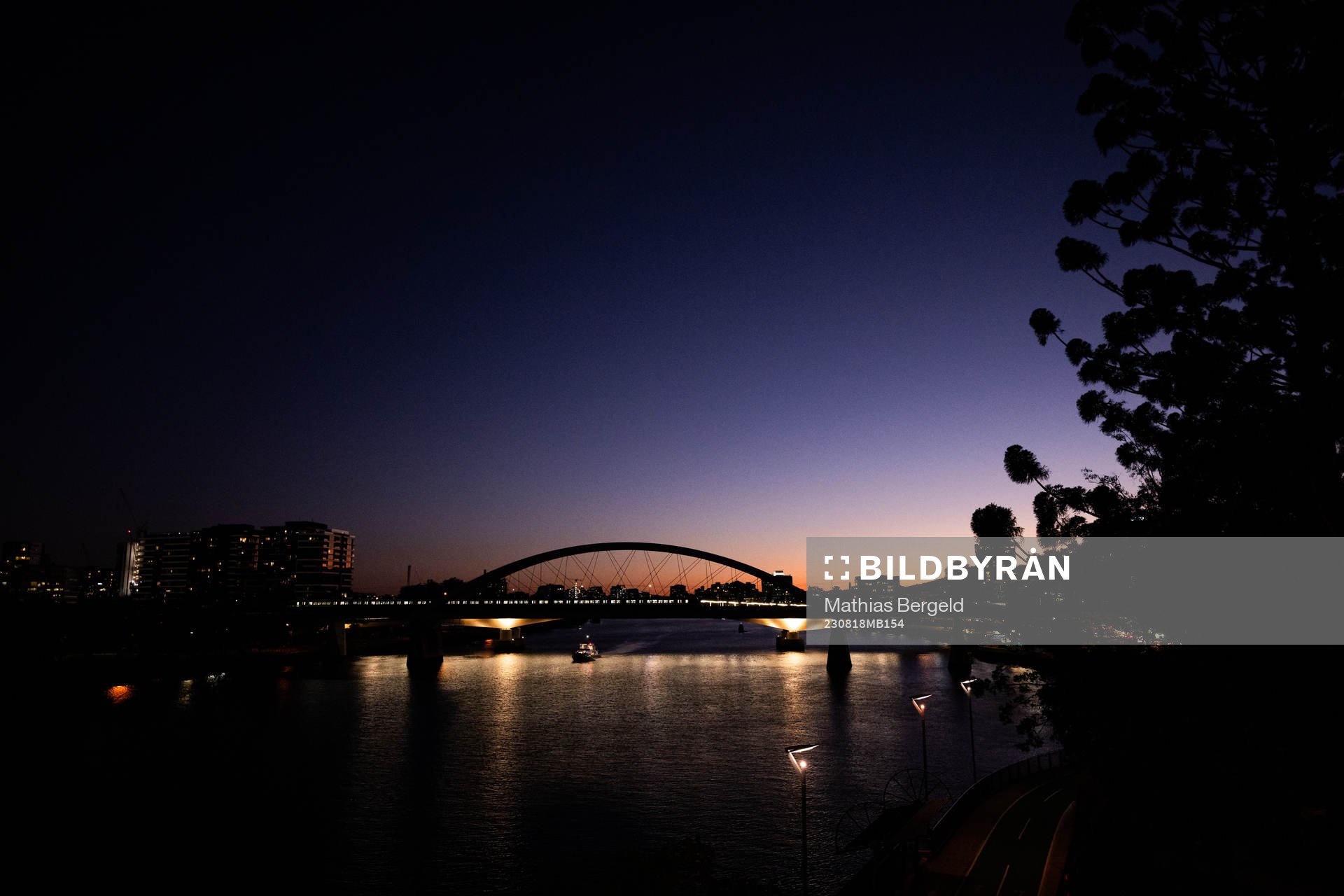 A bridge over Yarra River is seen at sunset