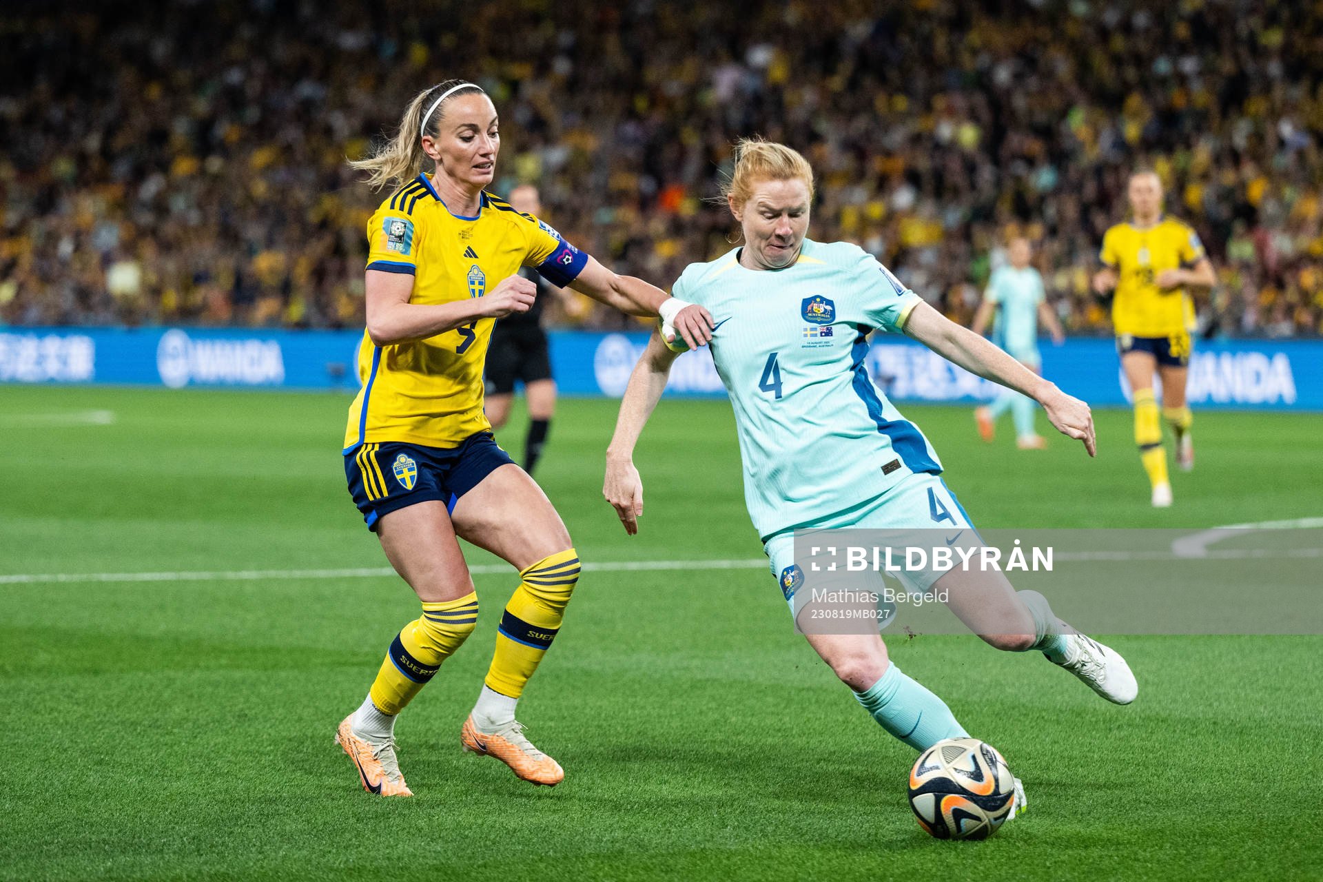 Kosovare Asllani of Sweden and Clare Polkinghorne of
