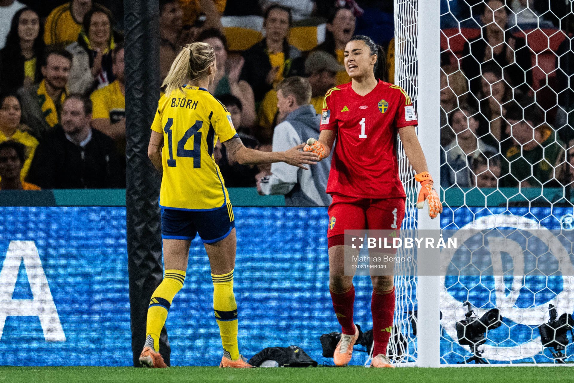 Nathalie Björn and goalkeeper Zecira Musovic of Sweden
