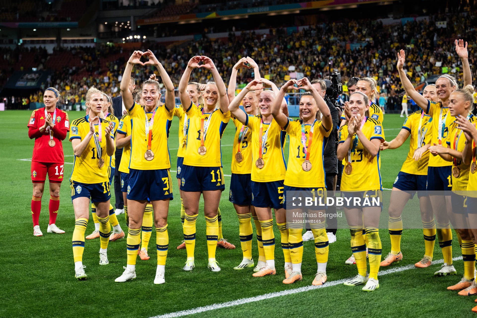 Players of Sweden celebrate with their bronze medals