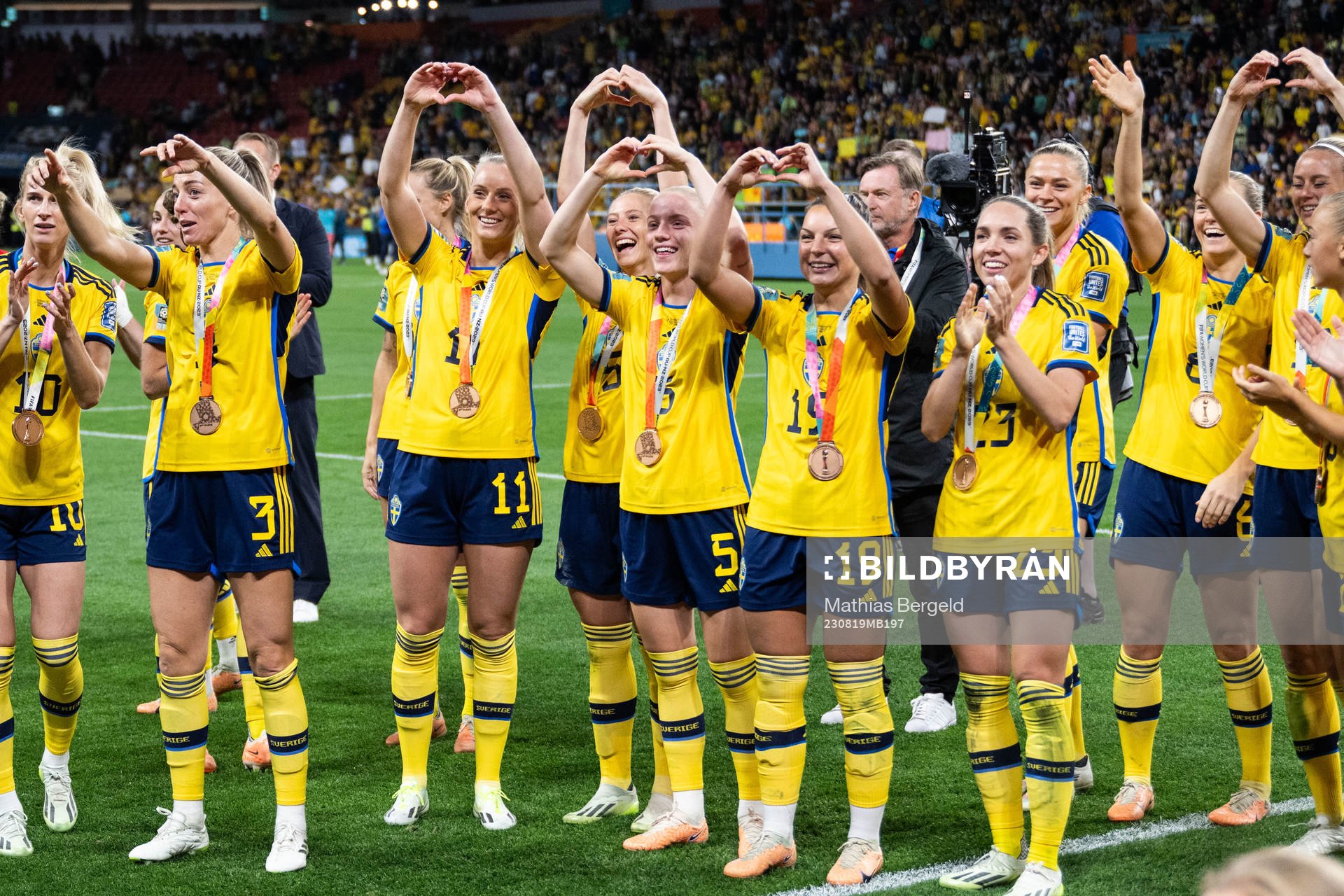 Players of Sweden celebrate with their bronze medals