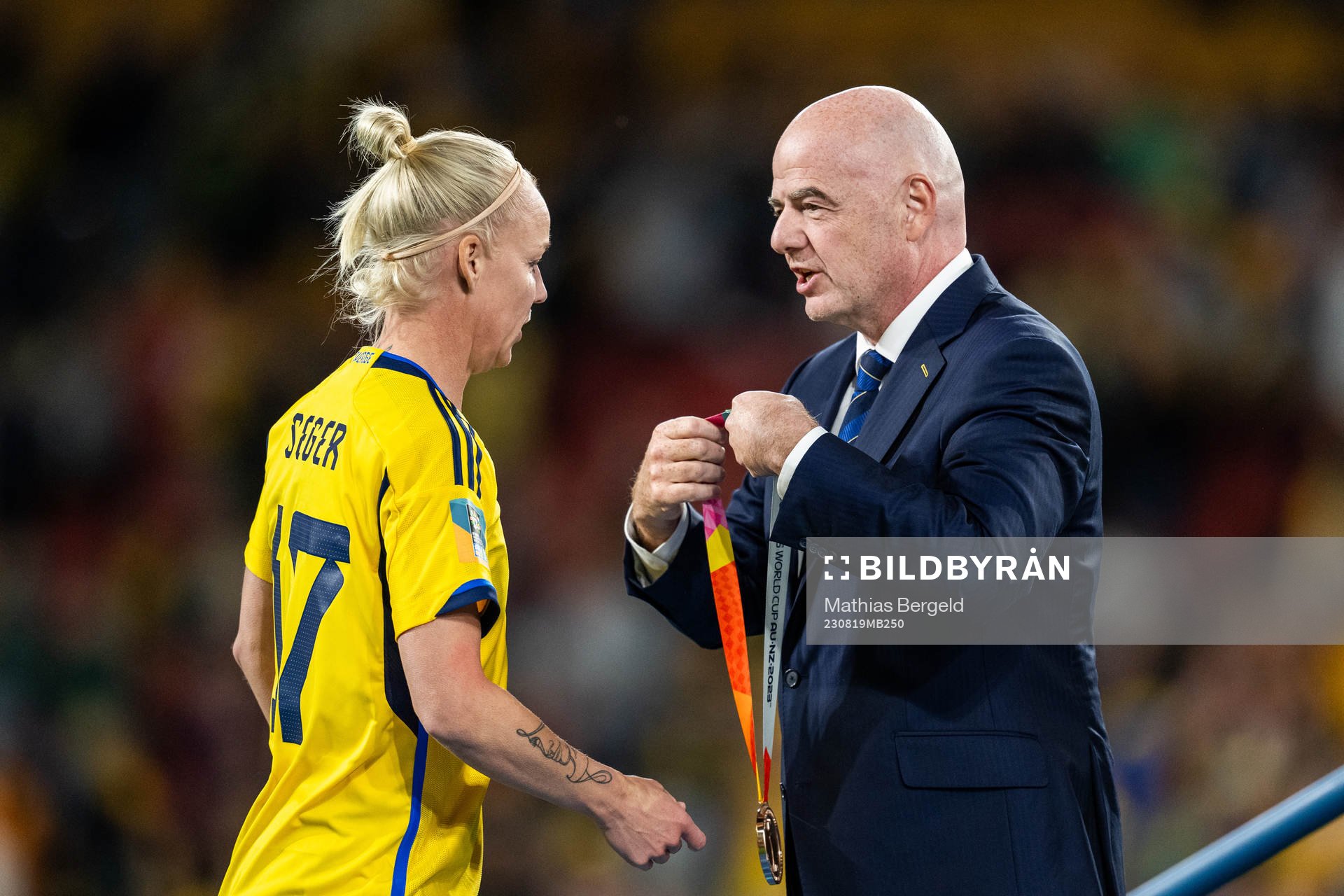 Caroline Seger of Sweden receives her medal from FIFA president Gianni Infantino during the FIFA Women's World Cup bronze medal match between Sweden and Australia on August 19, 2023 in Brisbane.