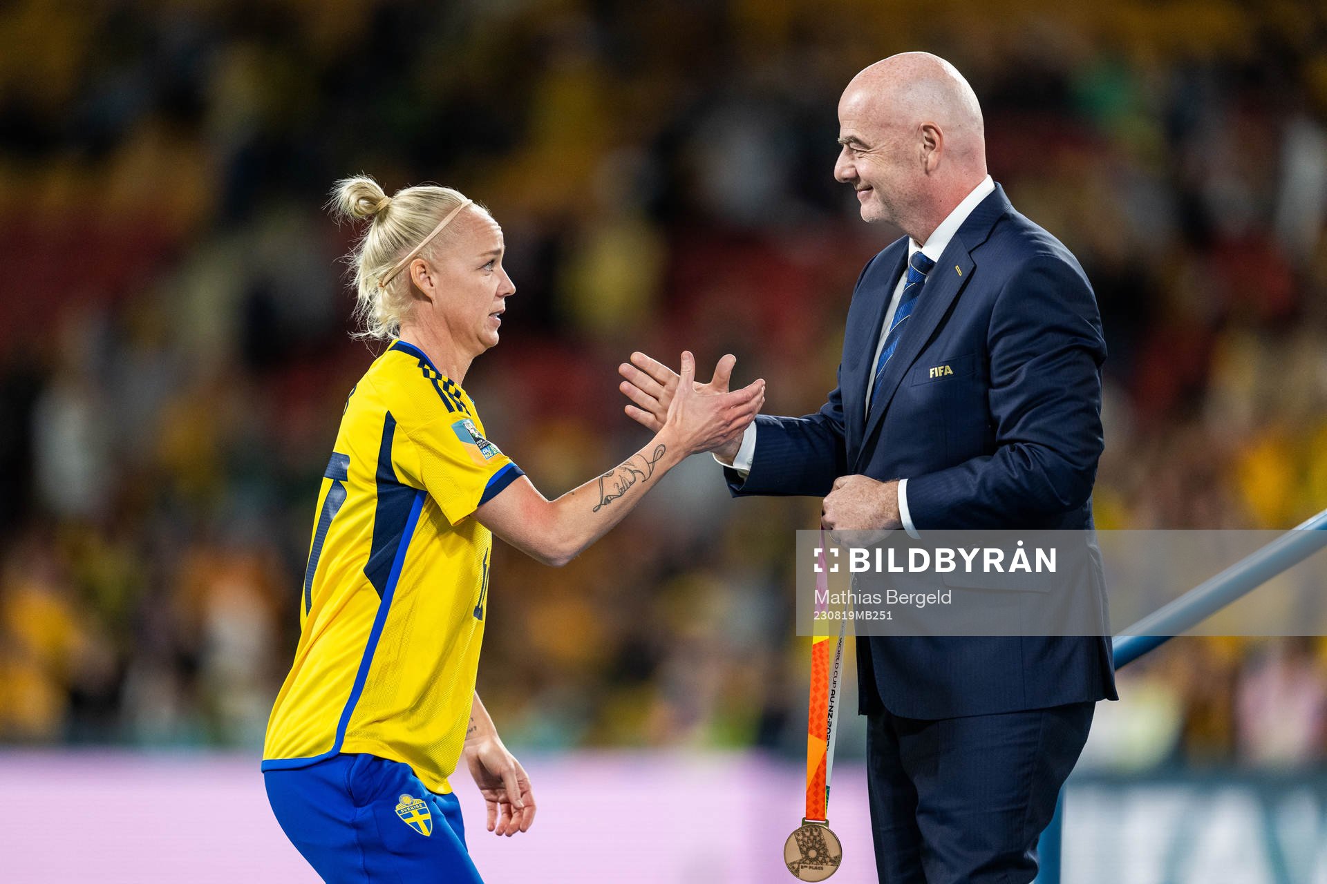 Caroline Seger of Sweden receives her medal from FIFA