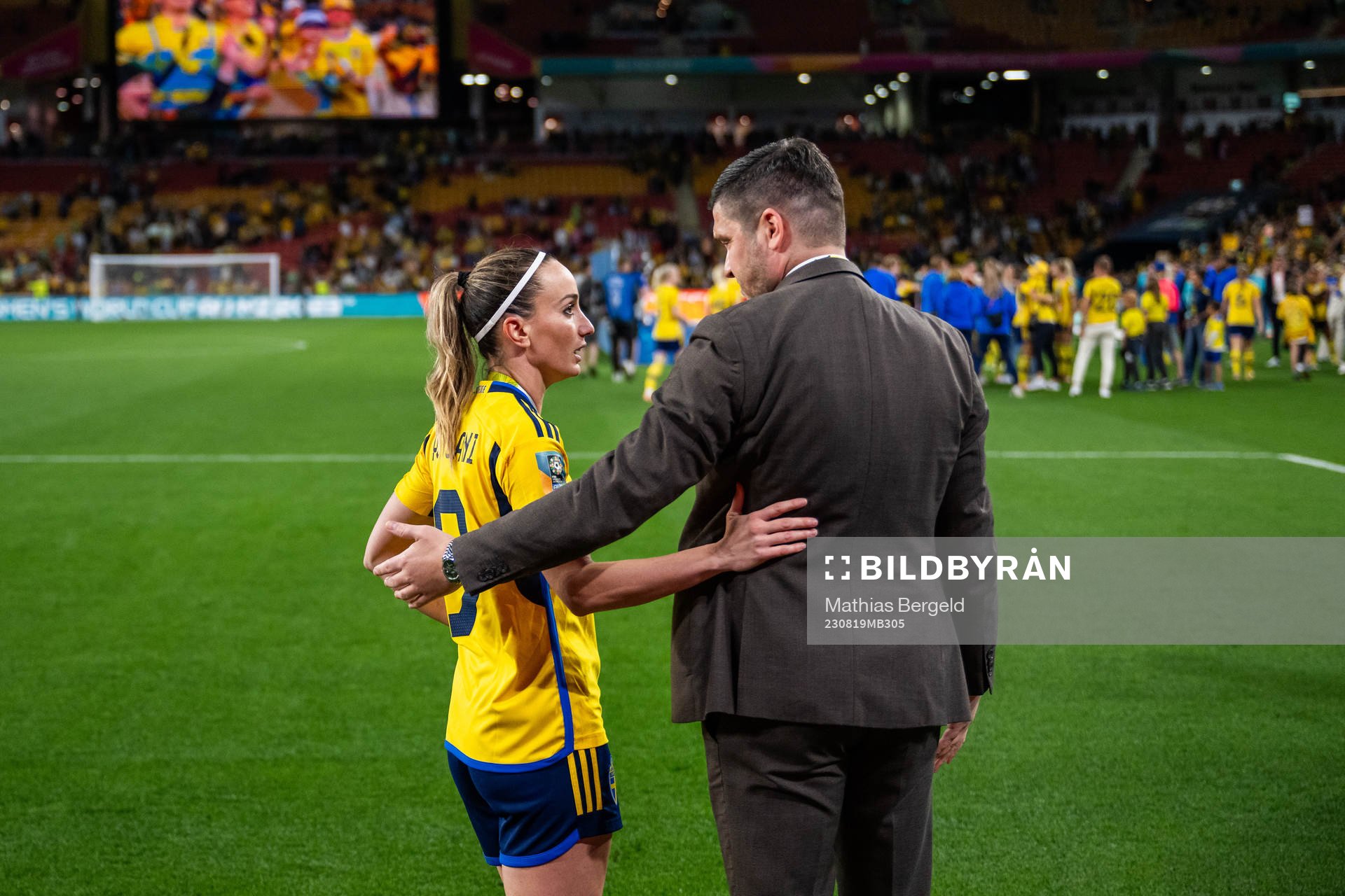 Kosovare Asllani of Sweden talks to Bojan Djordjic, of