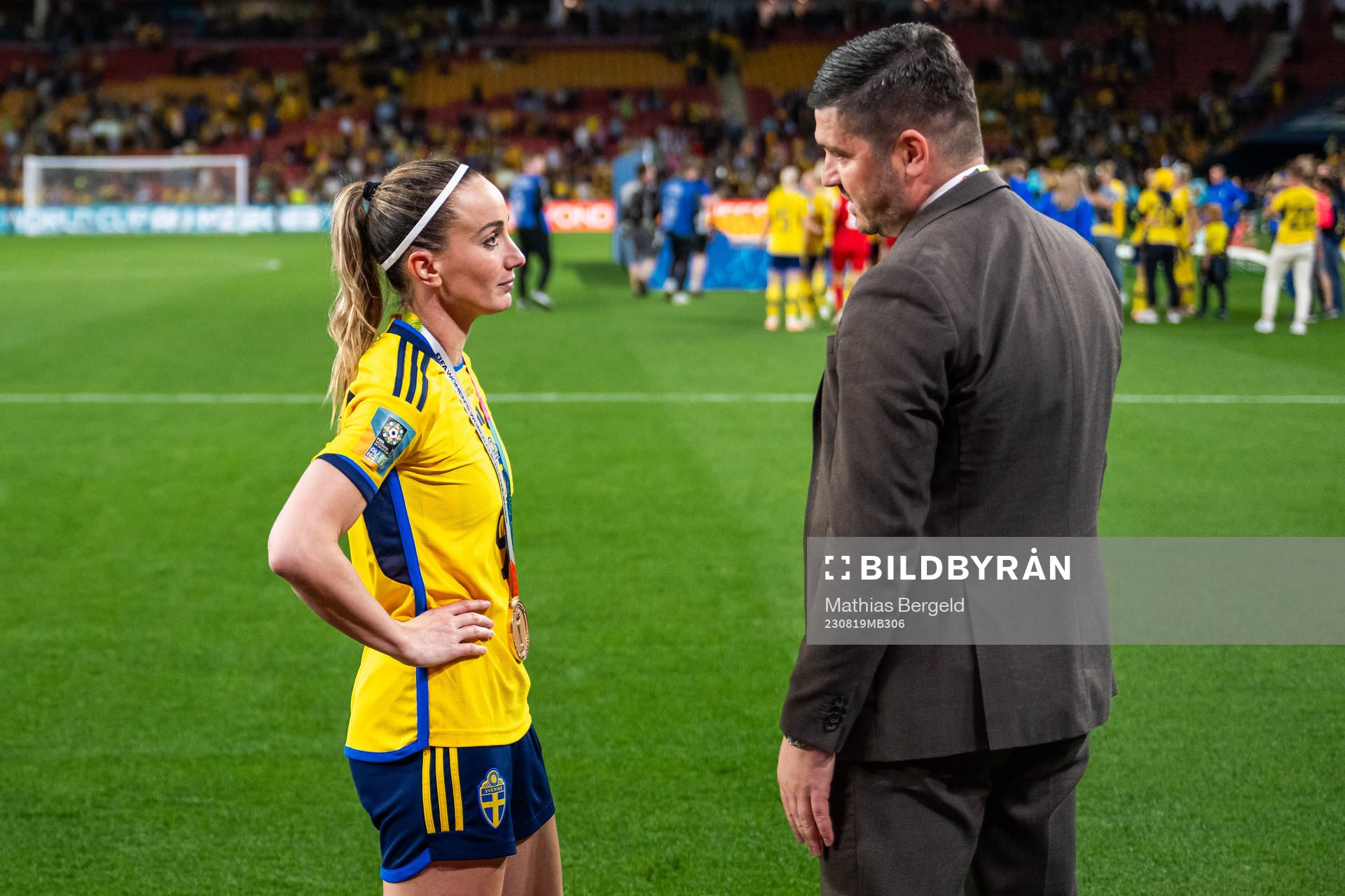 Kosovare Asllani of Sweden talks to Bojan Djordjic, of