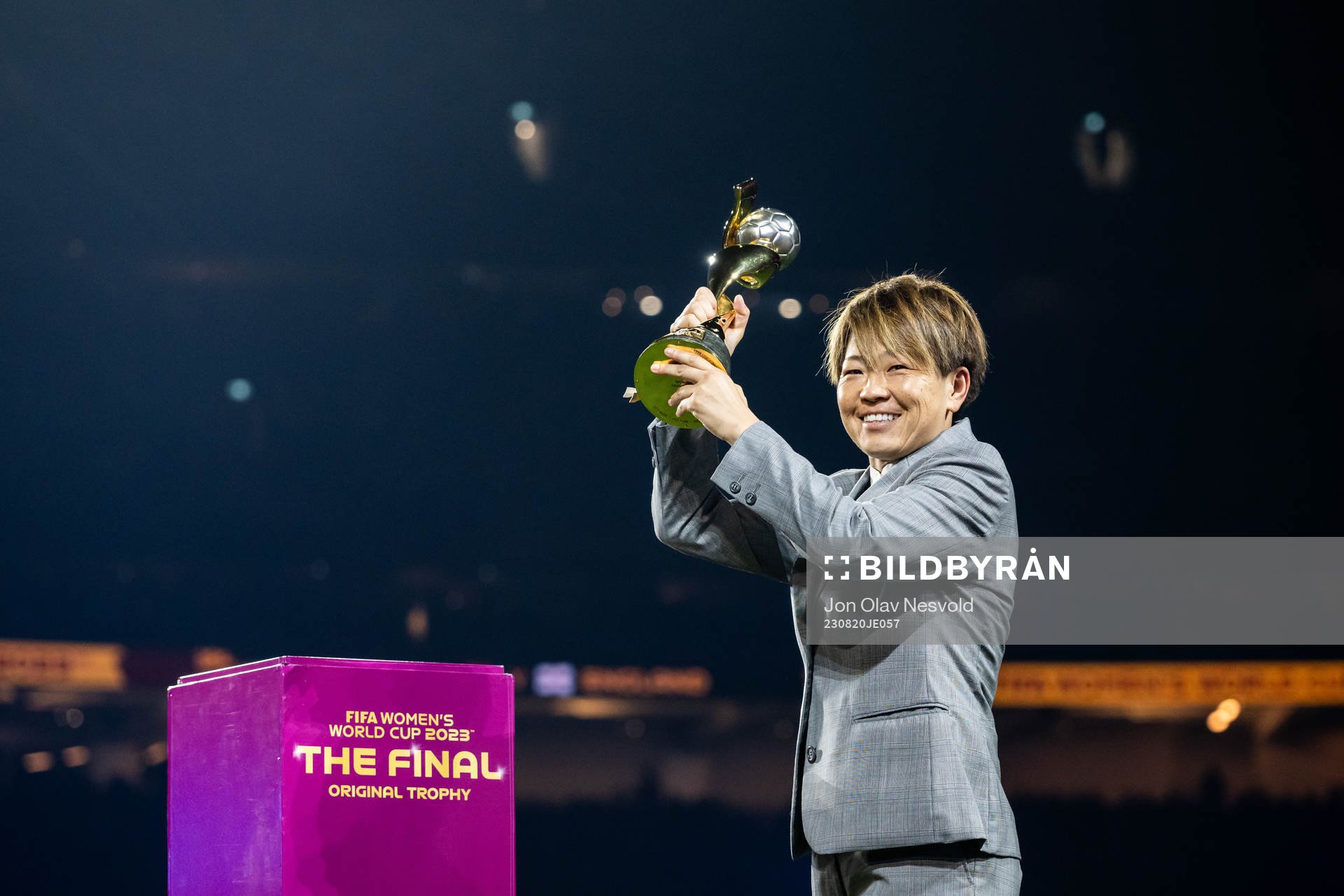 Aya Miyama with the World Cup trophy