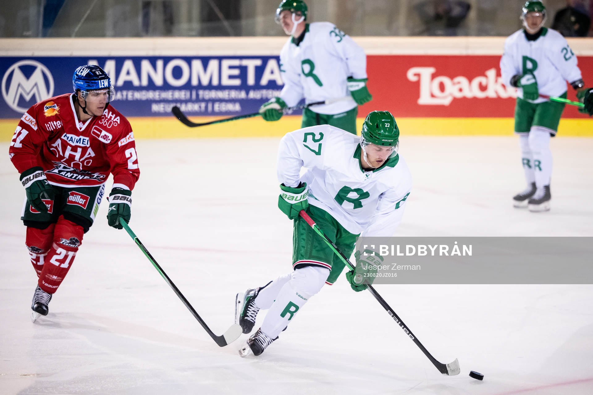 Linus Sjödin of Rögle and Jere Karjalainen of Augsburger